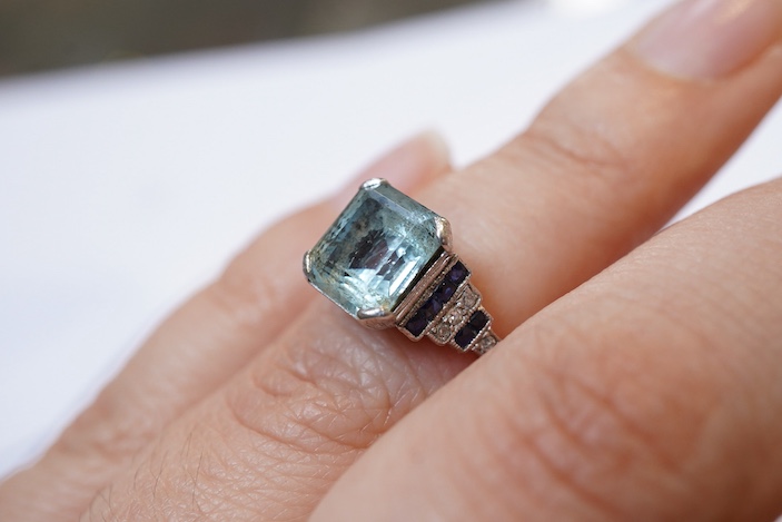 An aquamarine, sapphire and diamond ring